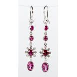 Pair of ruby, tourmaline and white gold earrings Featuring (1) oval-cut tourmaline, weighing