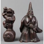 (lot of 2) Japanese ceramic okimono, consisting of a dancing shishi on a straw rice bag, holding a