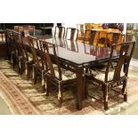 (lot of 11) Dining table and chairs, the table inset with floating top panels, raised on hoof form