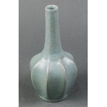 Chinese Guan type stickneck vase, with an eight-lobed body below the long slender neck, recessed