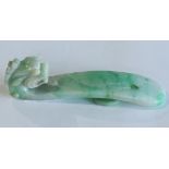 Chinese jadeite dragon belt hook, high relief carved with a dragon head and a plain contoured shaft,