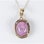 Star sapphire and 14k yellow gold necklace Featuring (1) oval star sapphire, measuring approximately