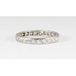 Diamond and platinum eternity band Featuring (20) single-cut diamonds, weighing approximately 0.50