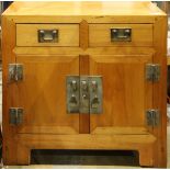 Chinese wooden coffer, fronted by a row of two drawers, above hinged double doors and a central