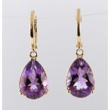 Pair of amethyst and 14k yellow gold earrings Featuring (2) pear-cut amethyst, weighing