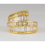 Diamond and 14k yellow gold ring Featuring (66) baguette-cut diamonds, weighing a total of