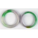 (Lot of 2) Jade bracelets Including 1) jade bangle, measuring approximately 12.4 mm in width and