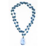Chinese glass bead necklace, consisting of 50-spherical blue beads, and a toggle of fruit accented