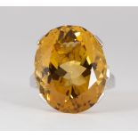 Citrine and 14k white gold Ring Featuring (1) oval-cut citrine, weighing approximately 28.30 cts.,