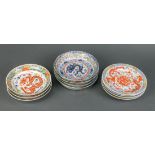 (lot of 11) Chinese porcelain dragon dishes: consisting of four small plates centered with a