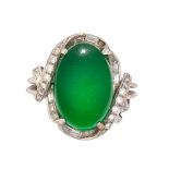 Jadeite, diamond and platinum ring Featuring (1) oval jadeite cabochon, measuring approximately 18.