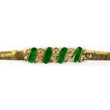 Jadeite, diamond and 18k yellow gold bracelet Featuring (4) saddle shaped jadeite tablets, measuring