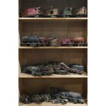 Four shelves of mostly Lionel train cars, such as a no. 310 and 517 cars, etc. largest: 21"l