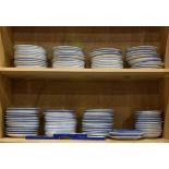 Two shelves of Royal Copenhagen Christmas and collector plates, mostly 1960s-1980s