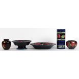 (lot of 5) Moorcroft ceramic group, each decorated with pomegranates, consisting of a cylindrical