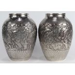 Pair of Persian silver palace vases, late 19th Century/early 20th Century, the urn form heavily