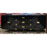 Moderne black lacquer credenza, having three drawers and two cabinet doors, with flush mount brass