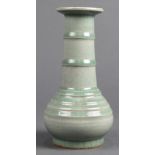 Chinese celadon crackle glazed ceramic vase, with an everted rim and ribbed neck, above the