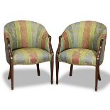 Pair of French bergeres, each having floral upholstery with brass nail head trim, and rising on