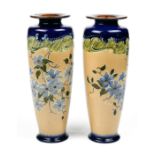 (lot of 2) Royal Doulton Slater cobalt vases, each having a tapered form with floral decoration on a