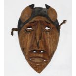 Cherokee Booger carved wood mask, 20th Century, depicting a horned figure with exaggerated