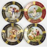(lot of 4) Royal Vienna hand-painted cabinet plates, each with a blue or red rim with elaborate gilt