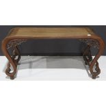 Chinese hardwood low table, inset with a floating top panel, spandrel pieced with dragon amid