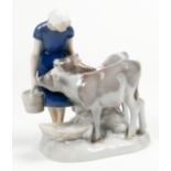 Bing and Grondahl figural sculpture depicting cows at the trough, standing beside a young girl