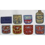 (lot of 8) Chinese embroidered wallets of various motifs, seven with flaps to either side concealing