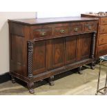 American Empire sideboard, executed in mahogany, having four drawers above the highly figured doors,