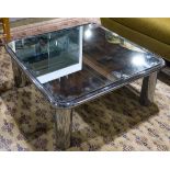 Hollywood Regency mirrored cocktail table, having a square body and rising on a chrome base having