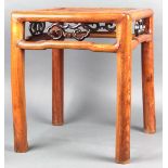 Chinese square wood stool, with a woven top and above an openwork ruyi head apron, raised on