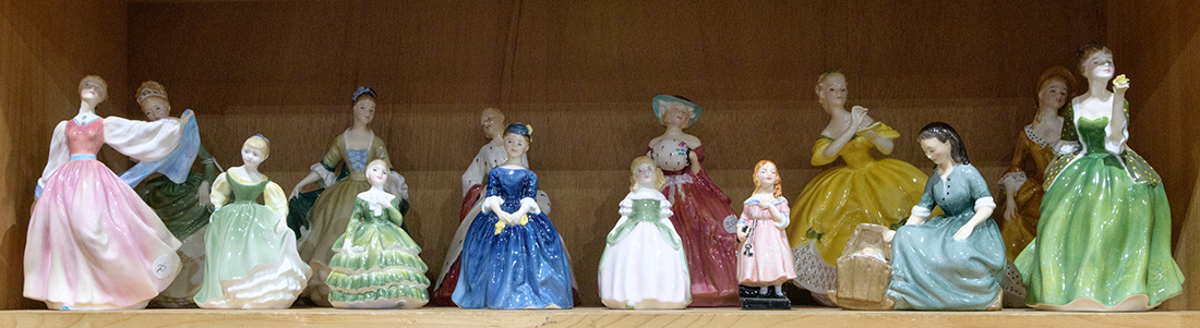 One shelf of Royal Doulton figurines, including "Fleur," "Gay Morning," and "Cherie," etc.