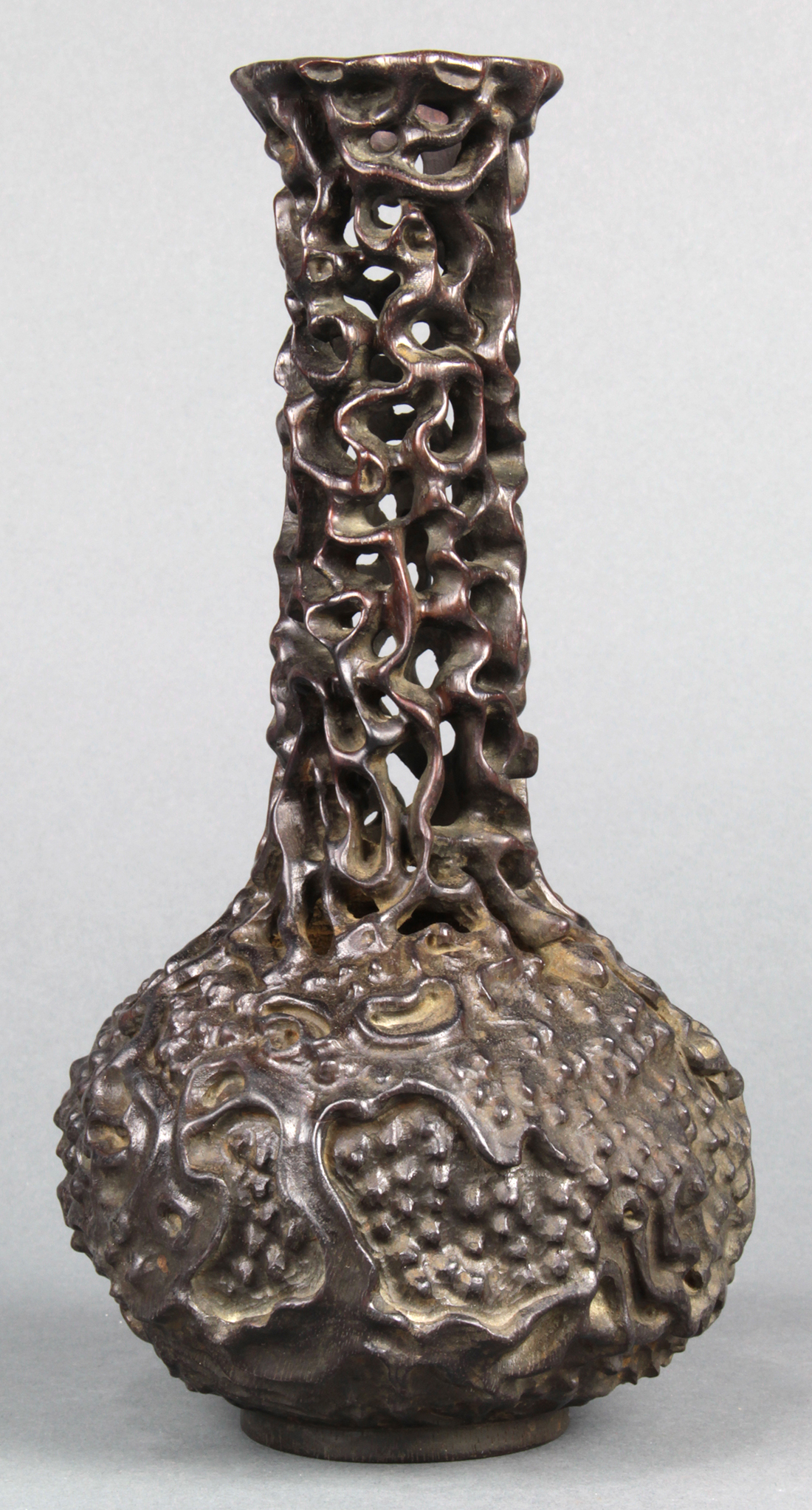 Chinese wooden stick neck vase, the long neck of openwork construction, above an ovoid body,