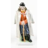 Herend porcelain figural sculpture, depicting an older, wiser gentleman standing, wearing a cap,