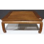 Chinese hardwood low table, inset with a floating top panel, above a bead edge apron, raised on