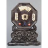 Chinese overlaid wood small table screen, of octagonal form inset with hardstone plaques of
