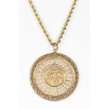 Yellow gold pendant-necklace Featuring 1) 10k yellow gold Asian motif disc, measuring