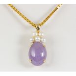 Jadeite, cultured pearl, 14k yellow gold pendant-necklace Featuring (1) lavender jadeite cabochon,