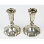 (lot of 2) Fisher Silversmiths Inc. sterling silver weighted candlesticks, each with a canted and