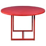 Modern red lacquer breakfast table, having a circular top, above square legs, 47"dia