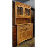 Art Nouveau style quarter sawn oak hutch, having beveled glass doors above two drawers and a two