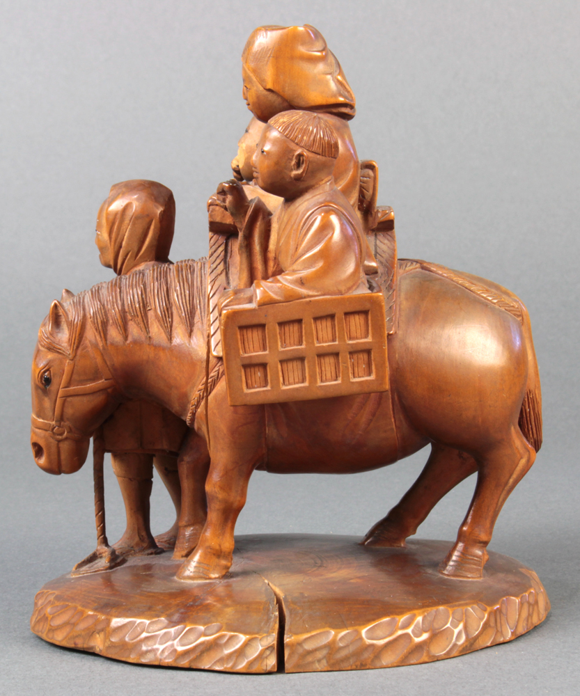 Japanese wood sculpture of tsuge wood, a woman and two boys riding on a horse, led by a smiling man, - Image 3 of 4