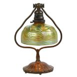Tiffany Studios patinated bronze desk lamp with a favrile glass shade