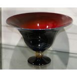 Art glass compote, having an outswept rim and tapering bowl, the exterior with an iridescent