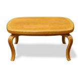 Thonet bentwood coffee table, having a shaped top, above contoured legs, 15"h x 33.5"dia.