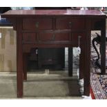 Chinese red lacquered table, fronted with five drawers, and raised on rectangular supports, 40.5"h