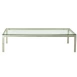 Italian Modern style low table, having a plate glass top, above a chrome frame, 15"h x 60"w x 20"d