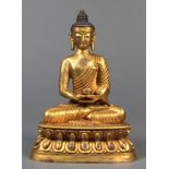Sino-Tibetan gilt bronze Buddha, draped in monk's robe holding an alms bowl, seated in dhyanasana on