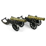 Pair of bronze and cast iron table cannons, having an adjustable closed barrel above the cast iron